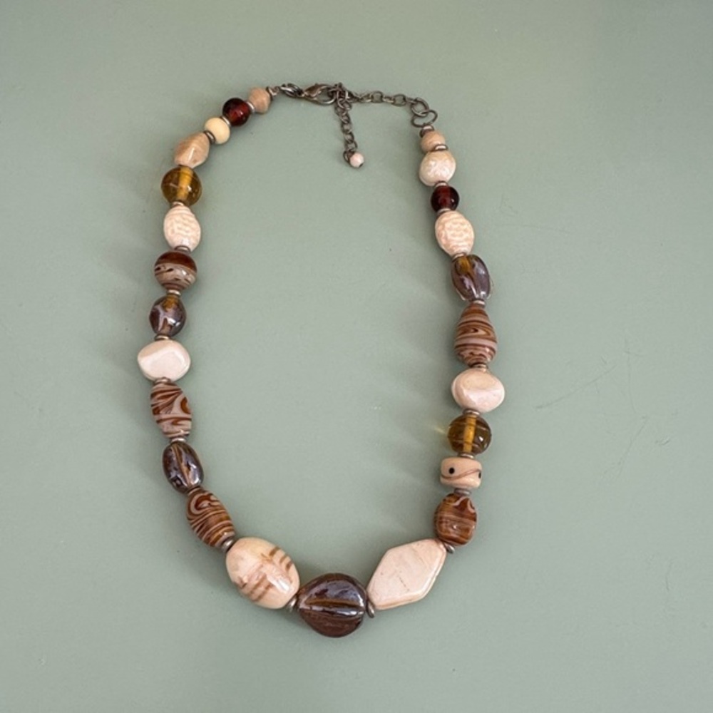 Blown glass necklace with brown and cream colored glass beads